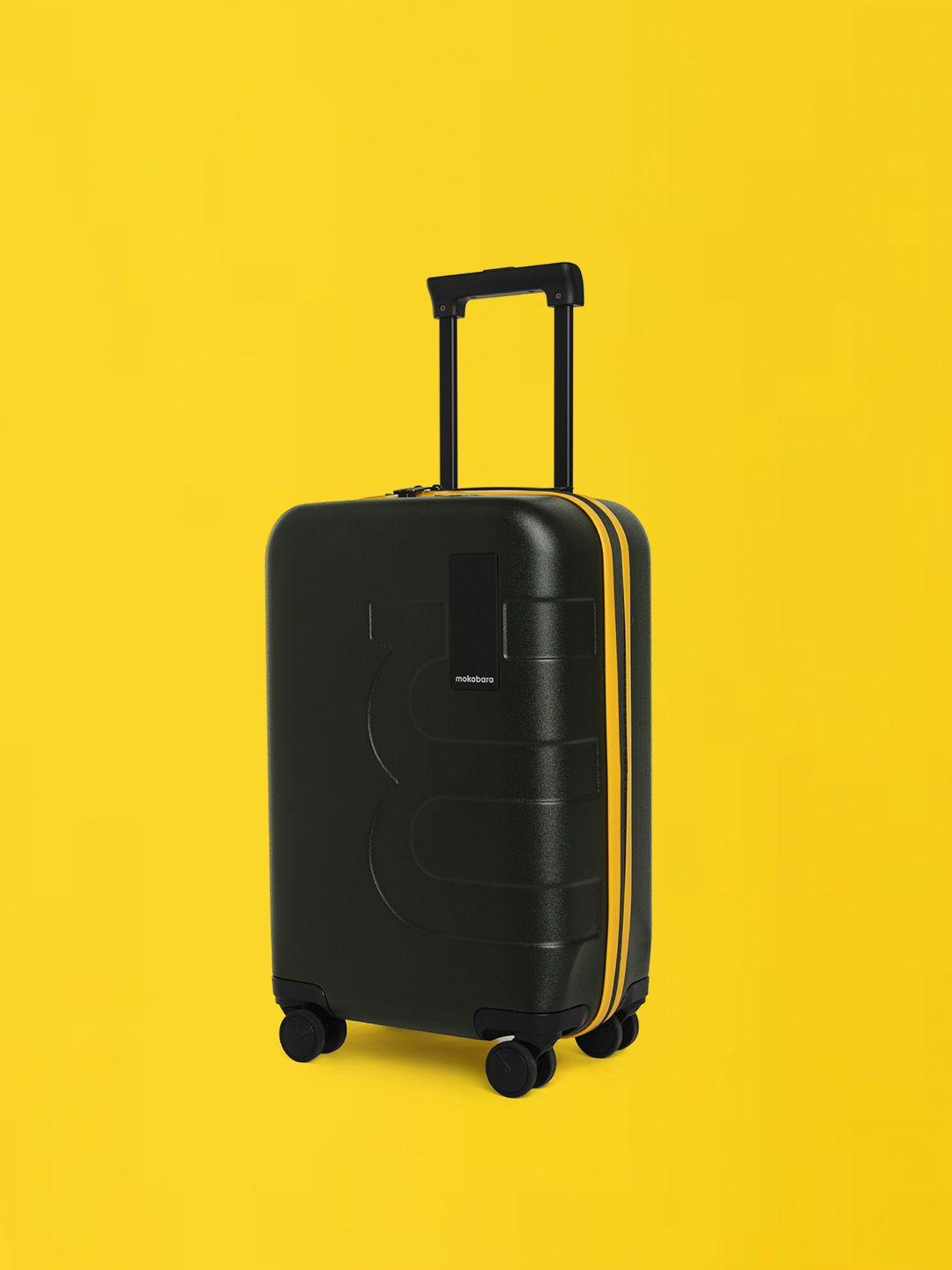 mokobara the em textured hard-sided small trolley suitcase