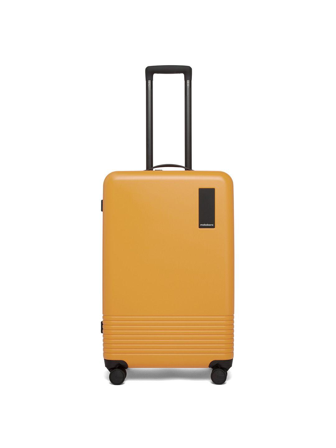 mokobara unisex yellow textured hard-sided medium trolley suitcase
