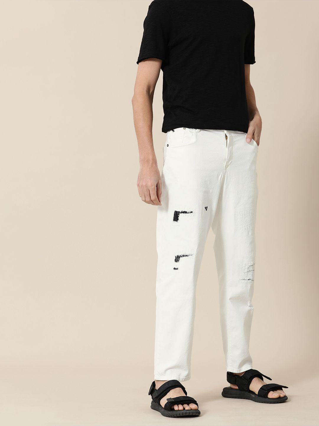 mr bowerbird men white tapered fit low distress mid-rise stretchable jeans