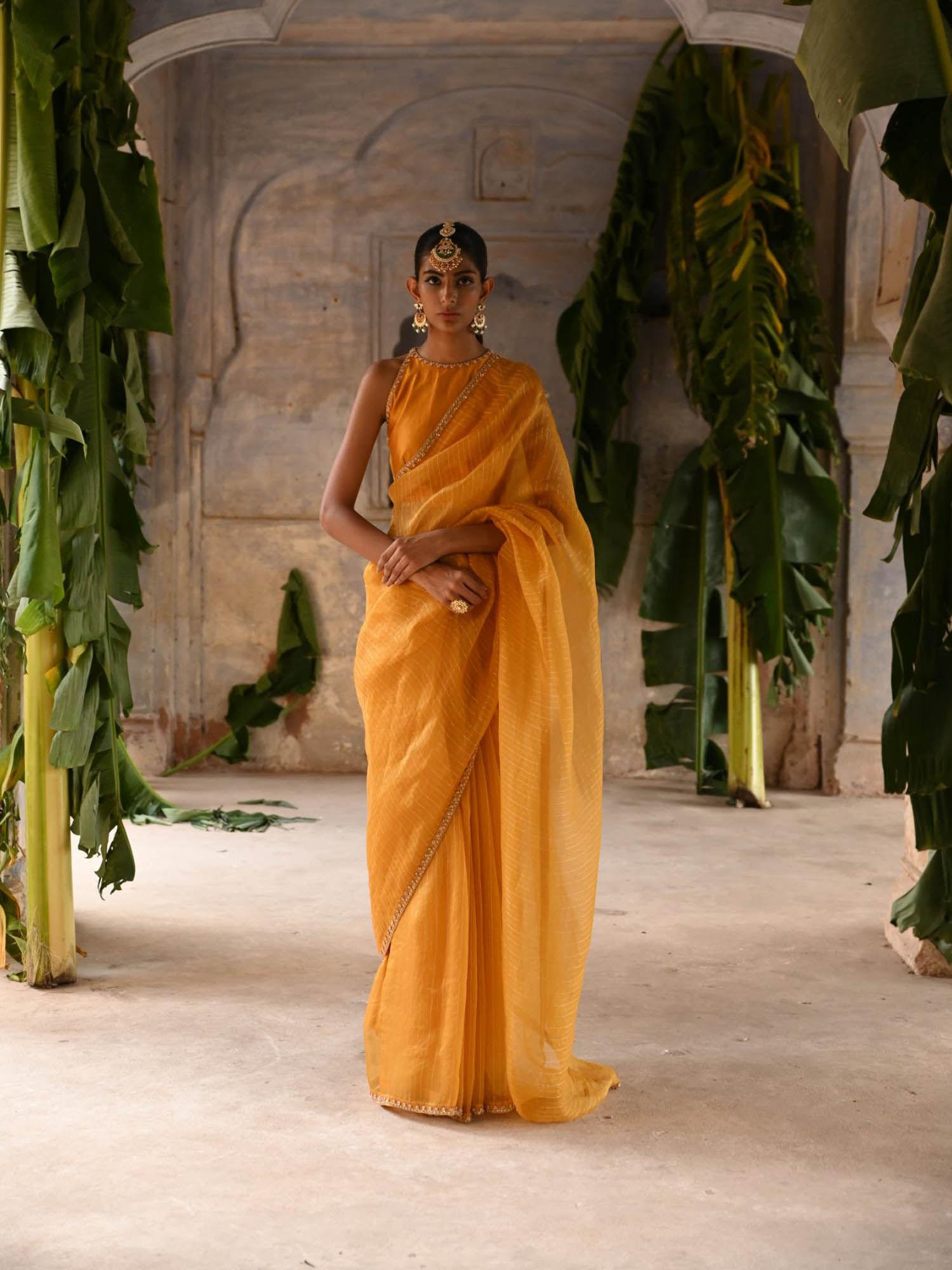 mustard yellow hand embroidered saree with stitched blouse