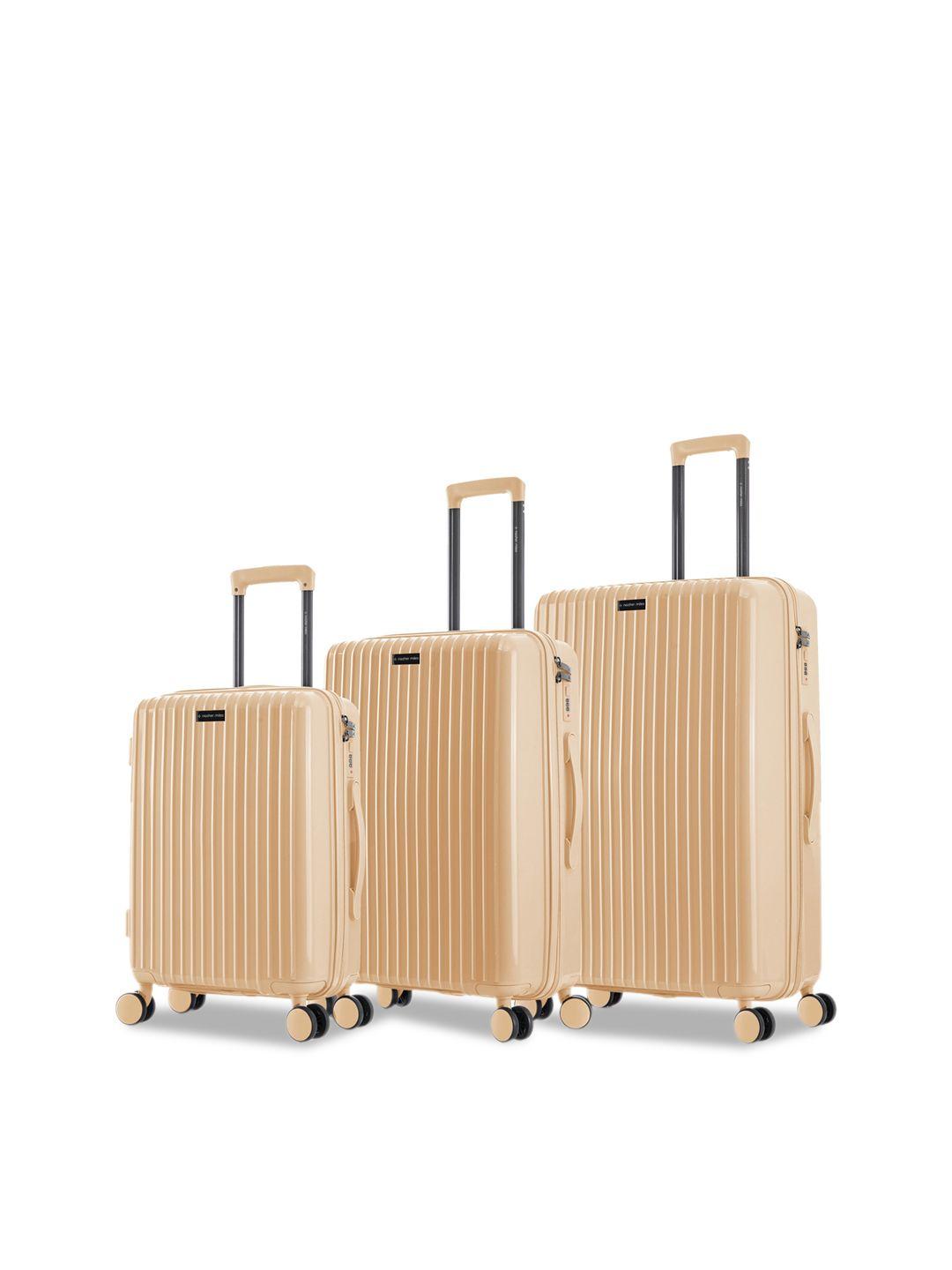 nasher miles auroville set of 3 peach textured hard-sided trolley bags
