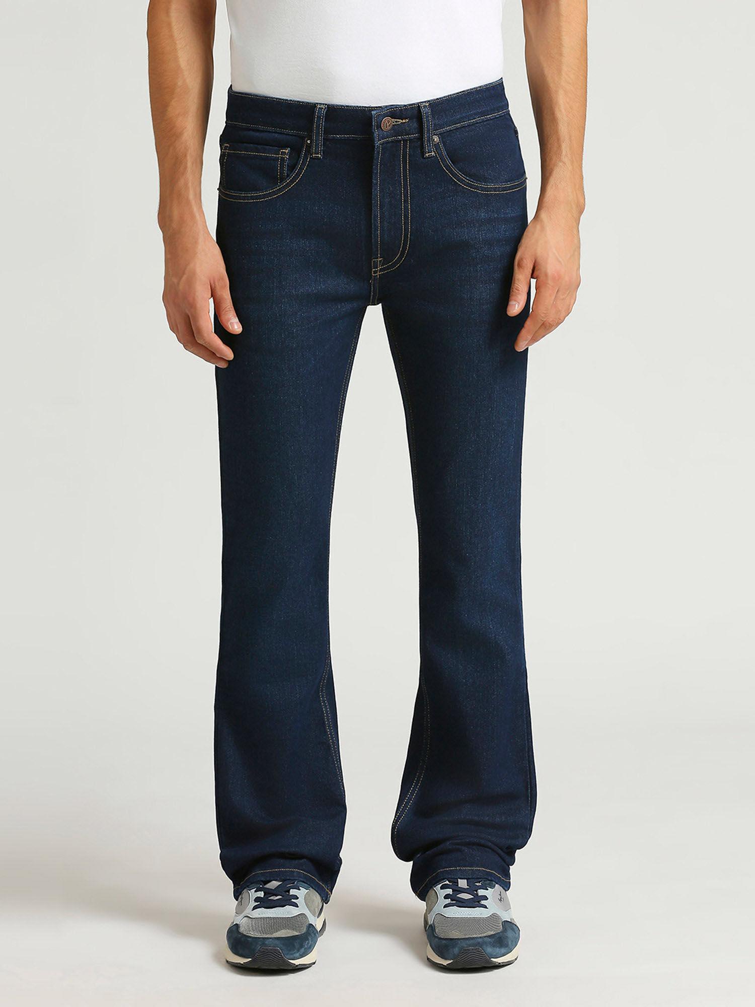 navy blue raw mid rise bootcut jeans