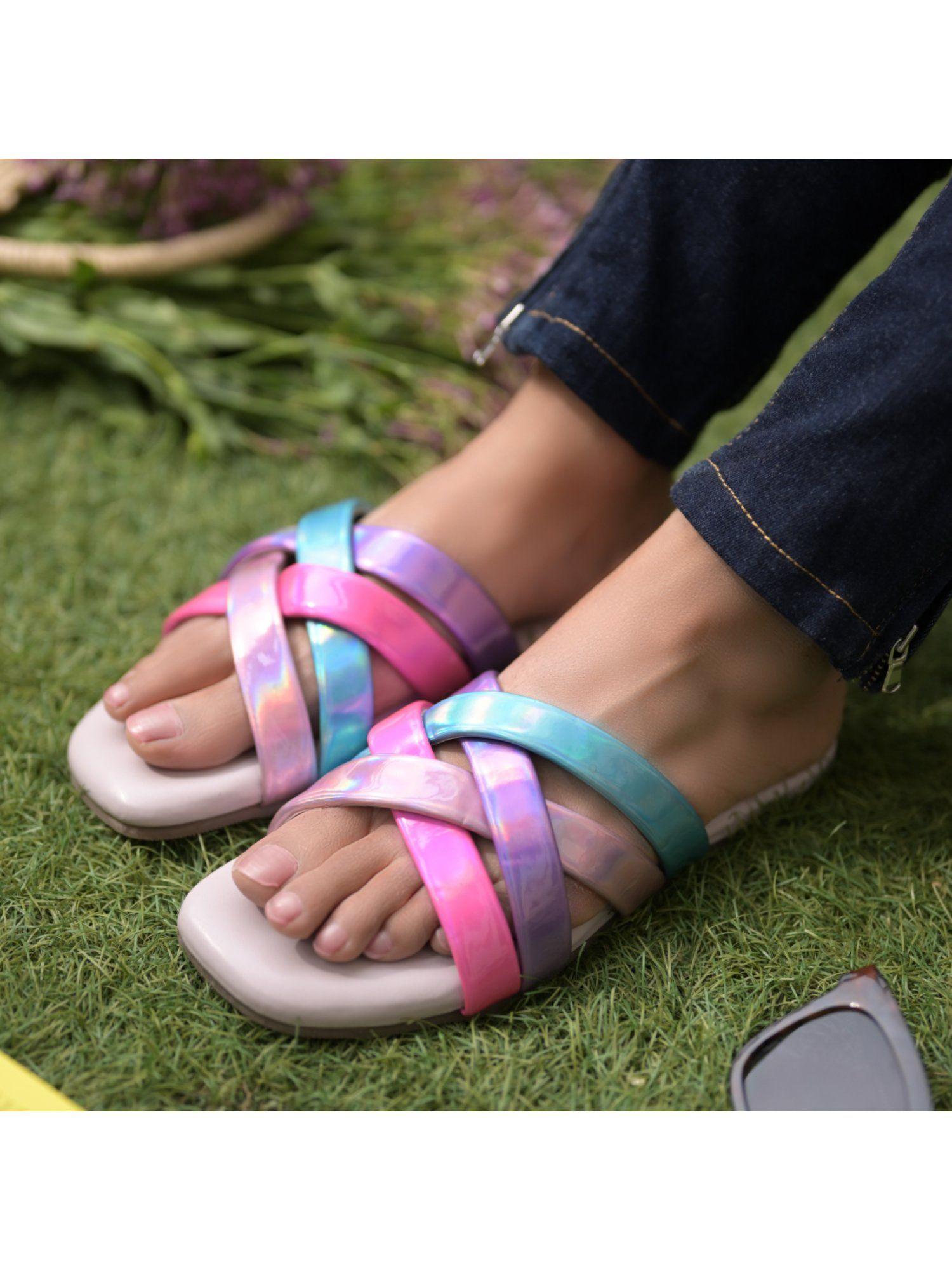 neon multi coloured flats with multiple straps set in a criss cross pattern