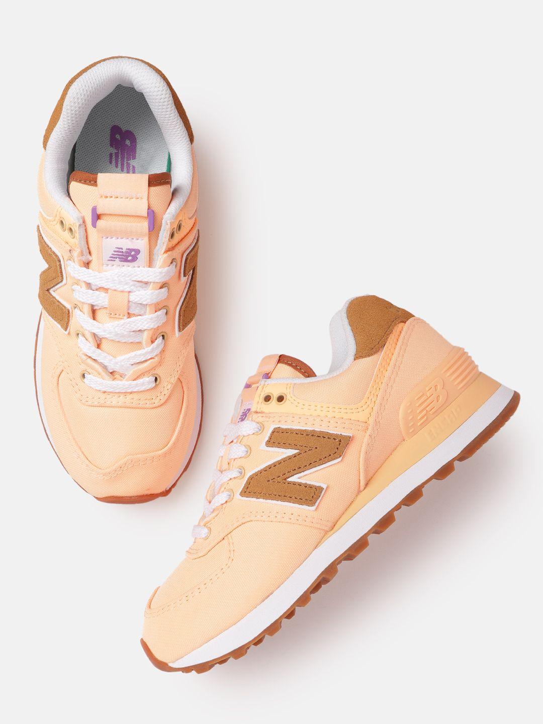 new balance women orange solid 574 sneakers