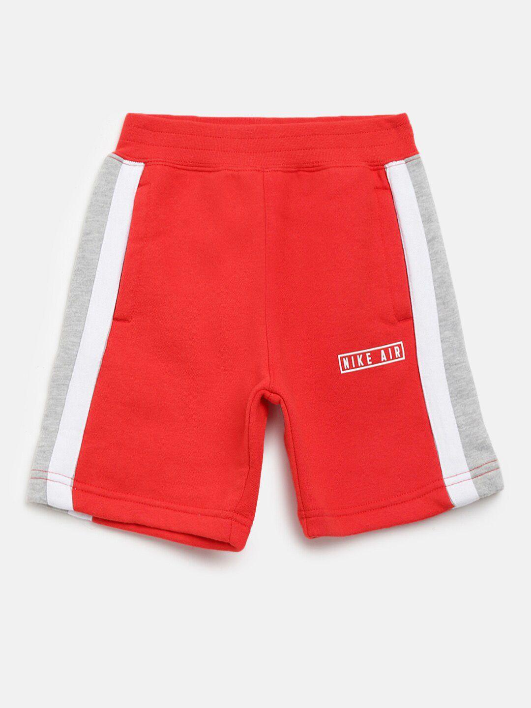 nike boys red & white solid sports shorts with side panels & air logo print detail