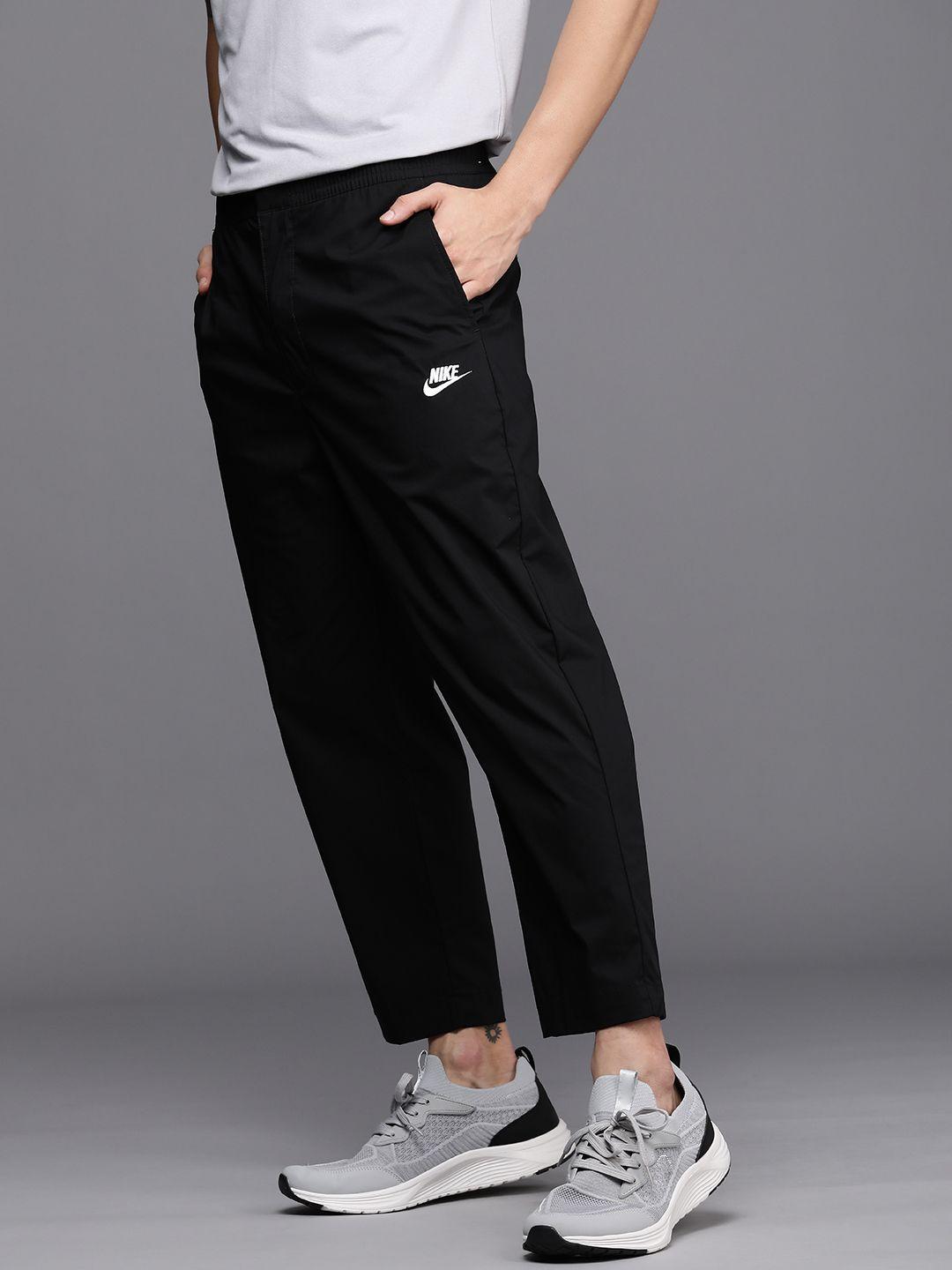 nike men black solid woven sneaker track pants