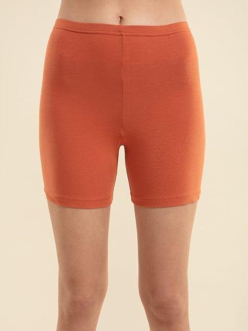 nykd orange cycling shorts