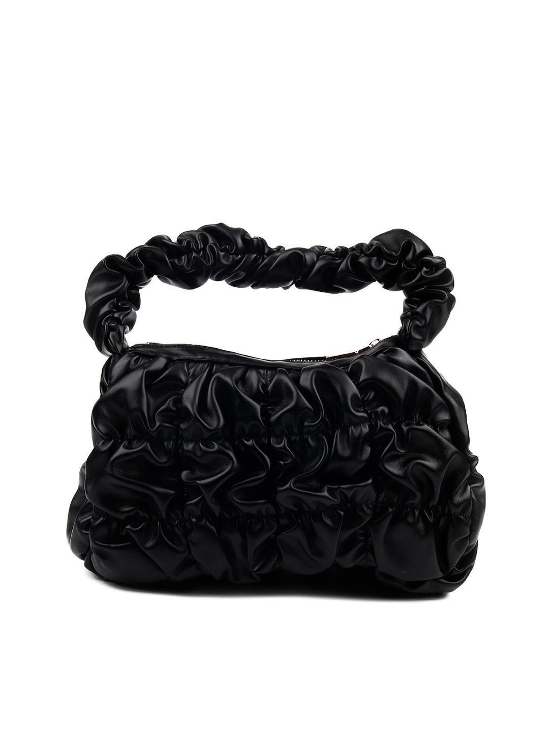odette black textured leather structured handheld bag with tasselled