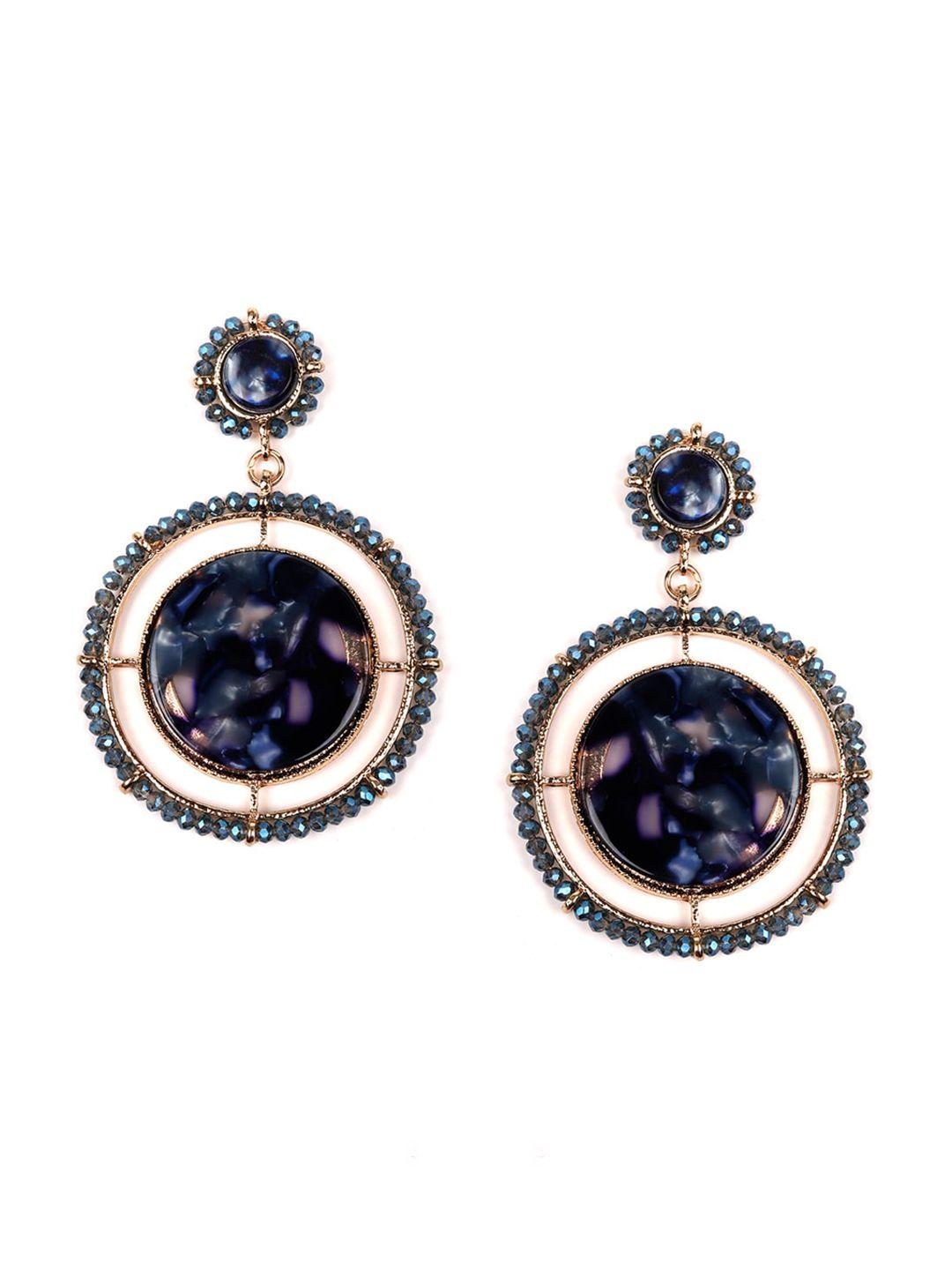 odette woman blue circular drop earrings