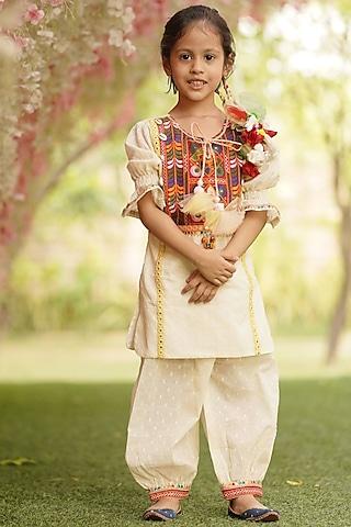off-white cotton kurta set with dori tassels for girls