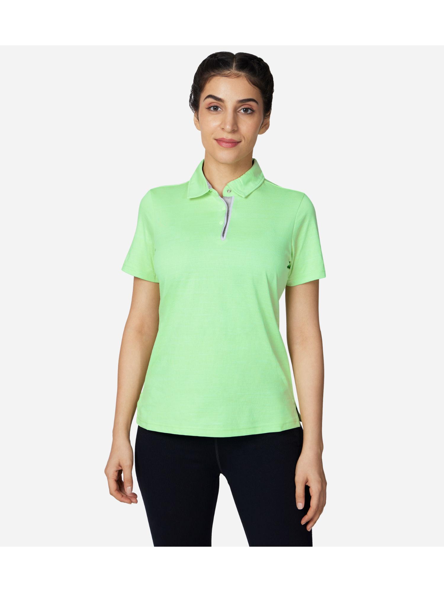 on the green polo t-shirt