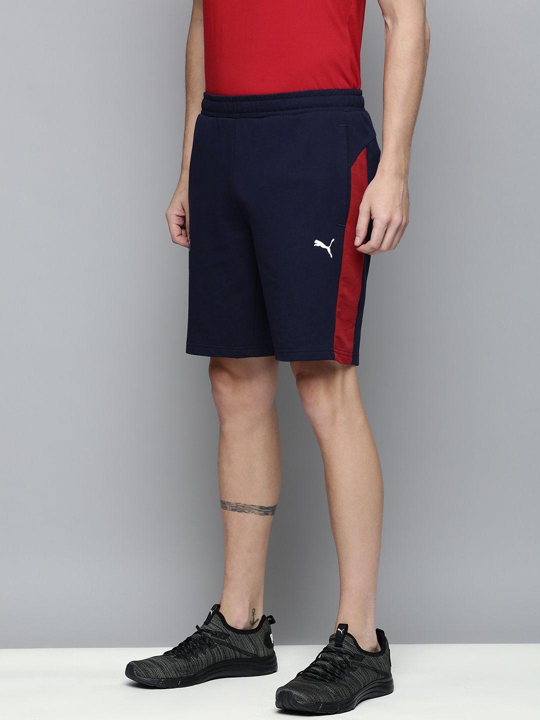 one8 x puma men navy blue solid mid-rise regular shorts with side contrast detail