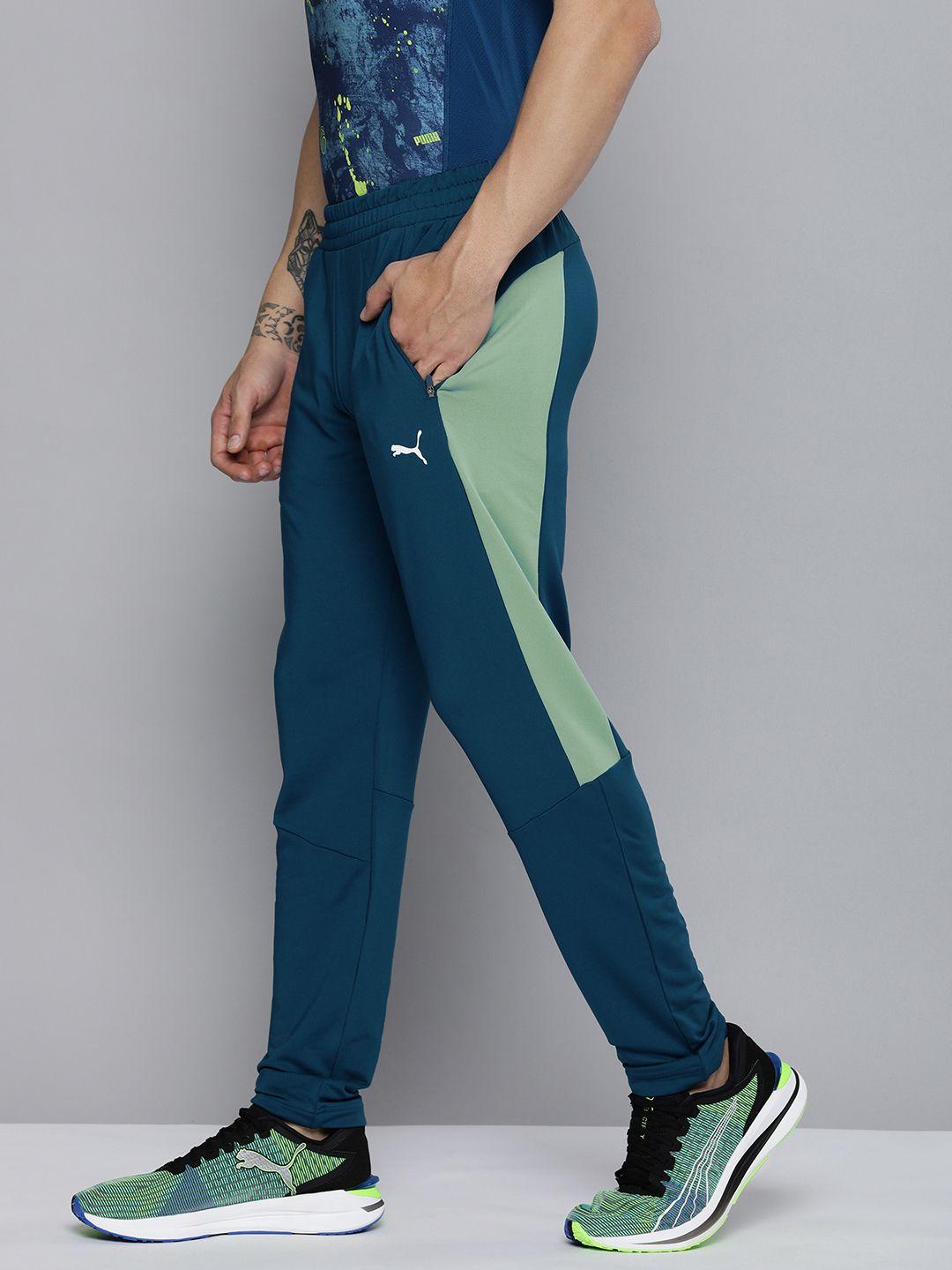 one8 x puma men teal blue & green colourblocked virat kohli woven track pants