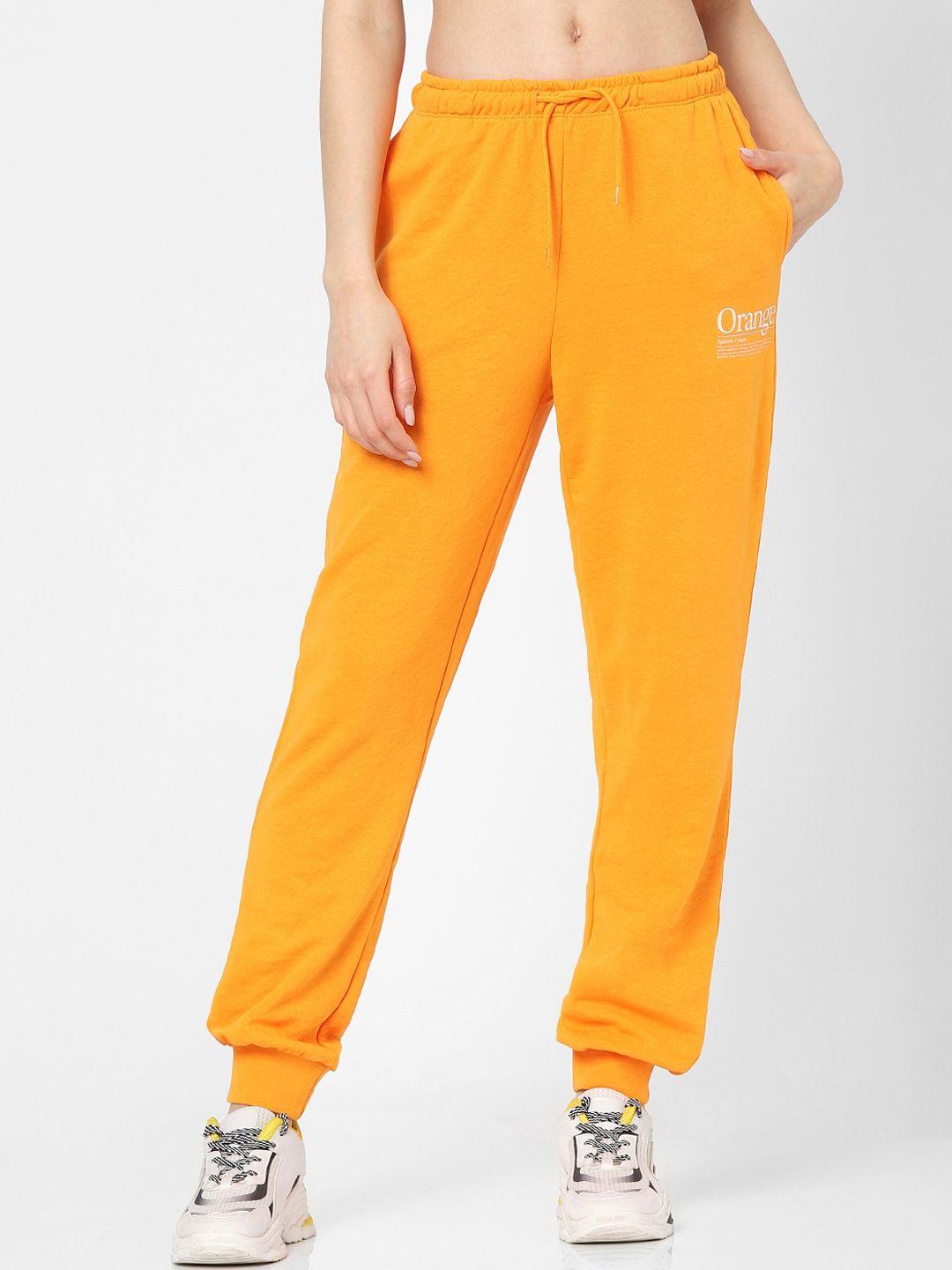 only women orange solid pure cotton joggers