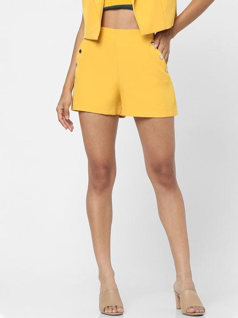 only yellow mid rise shorts