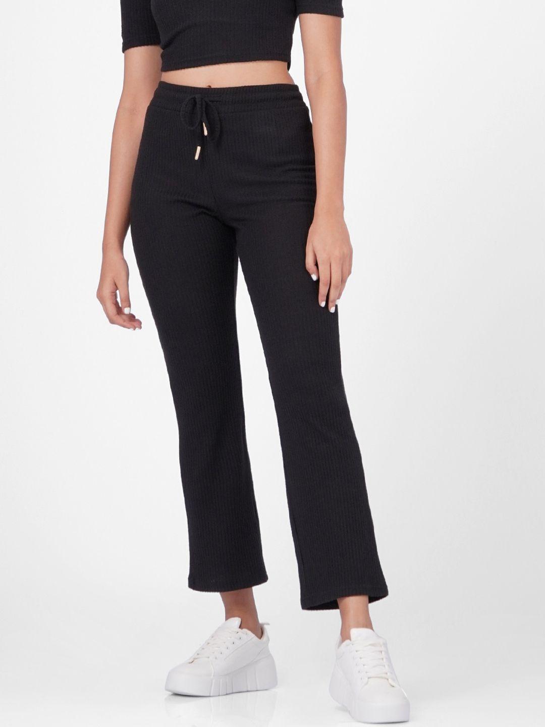 only women black solid flared track pants