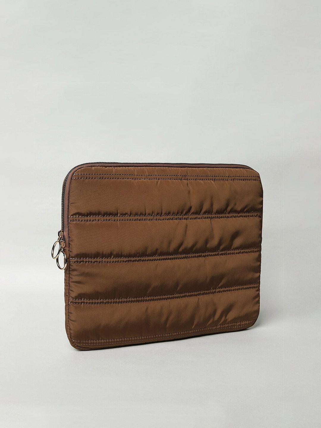 only women brown & cream-coloured laptop bag