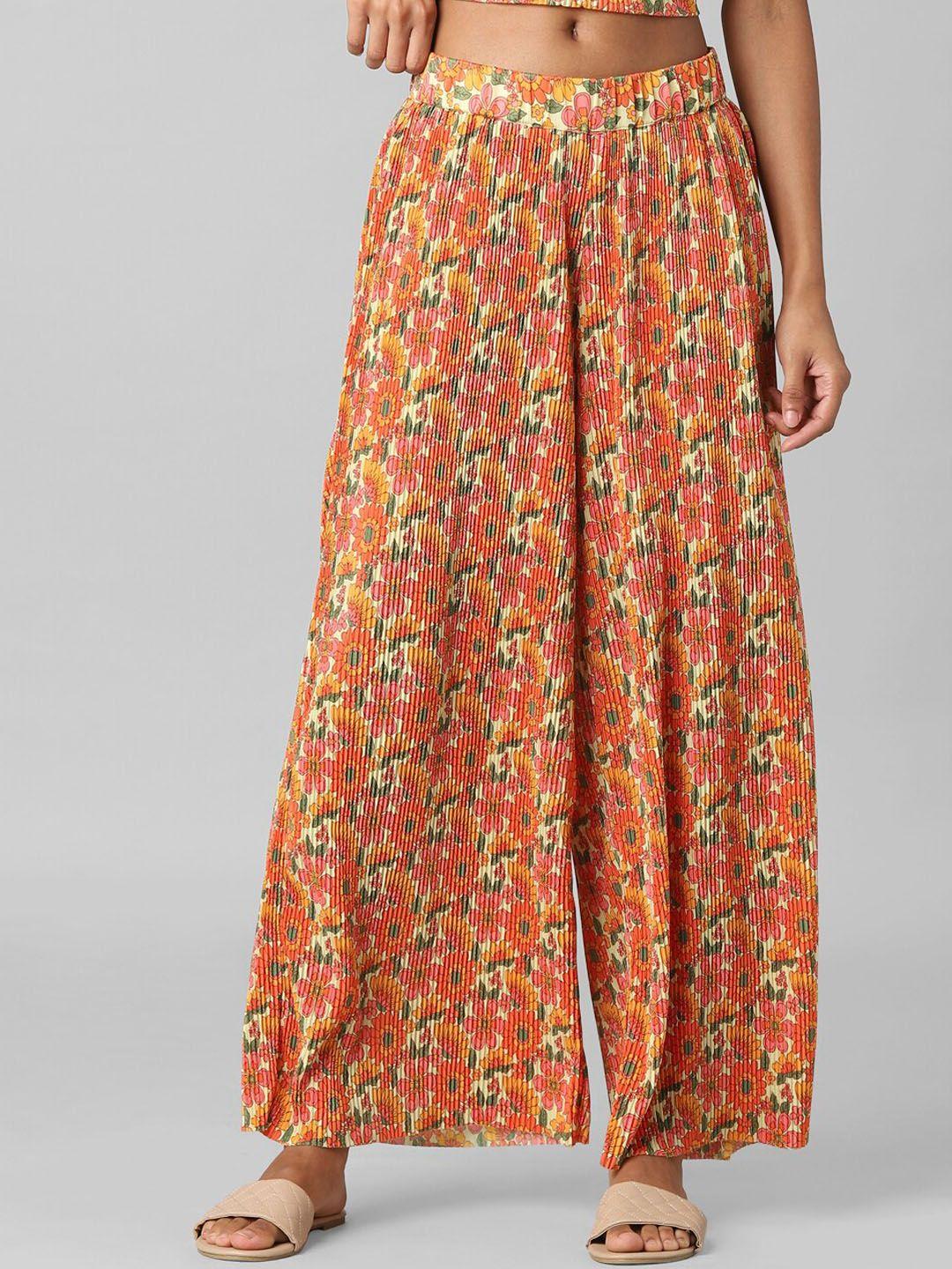 only women orange floral printed flared high-rise parallel trousers