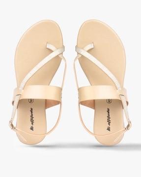 open-toe flat sandals with buckle closure