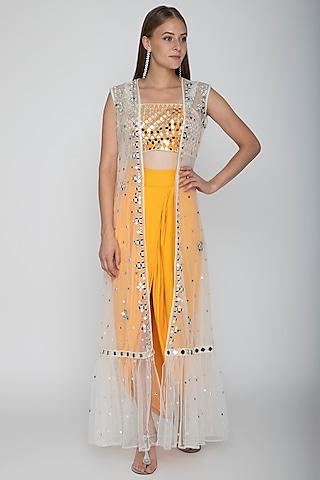 orange embroidered blouse with dhoti skirt & white cape