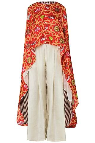 orange high-low layered printed cape with pleated pants