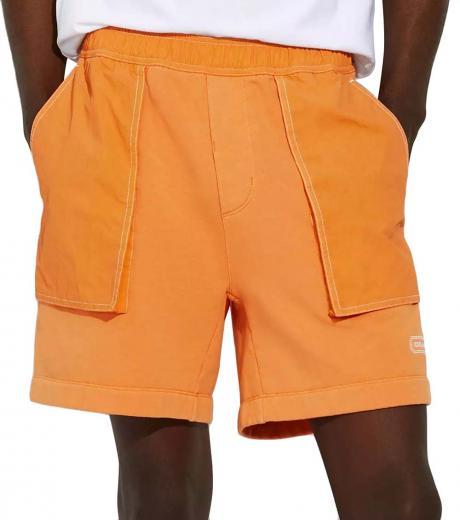 orange mixed material logo shorts