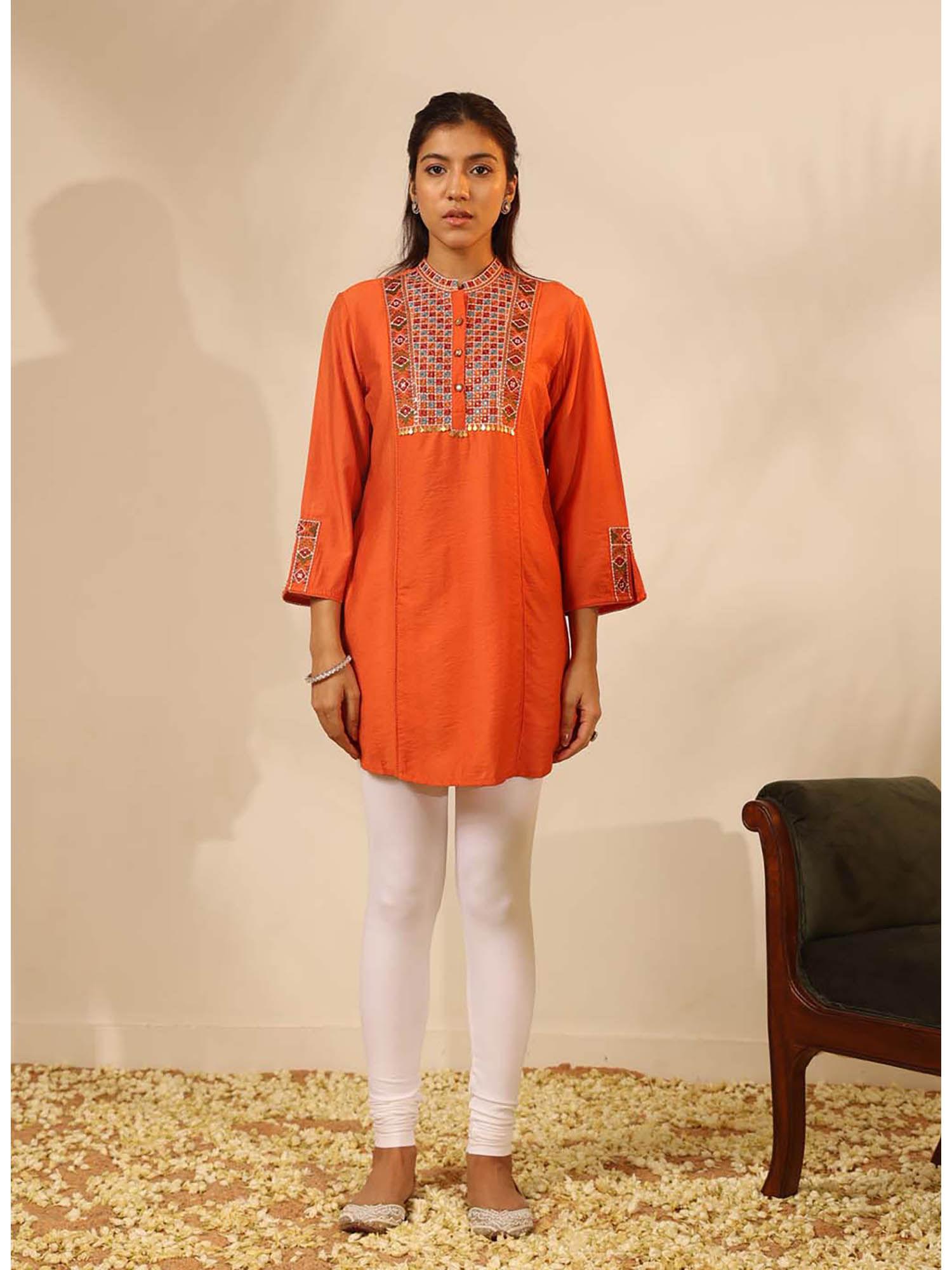 orange collared tunic with intricate embroidery and three fourth sleeves