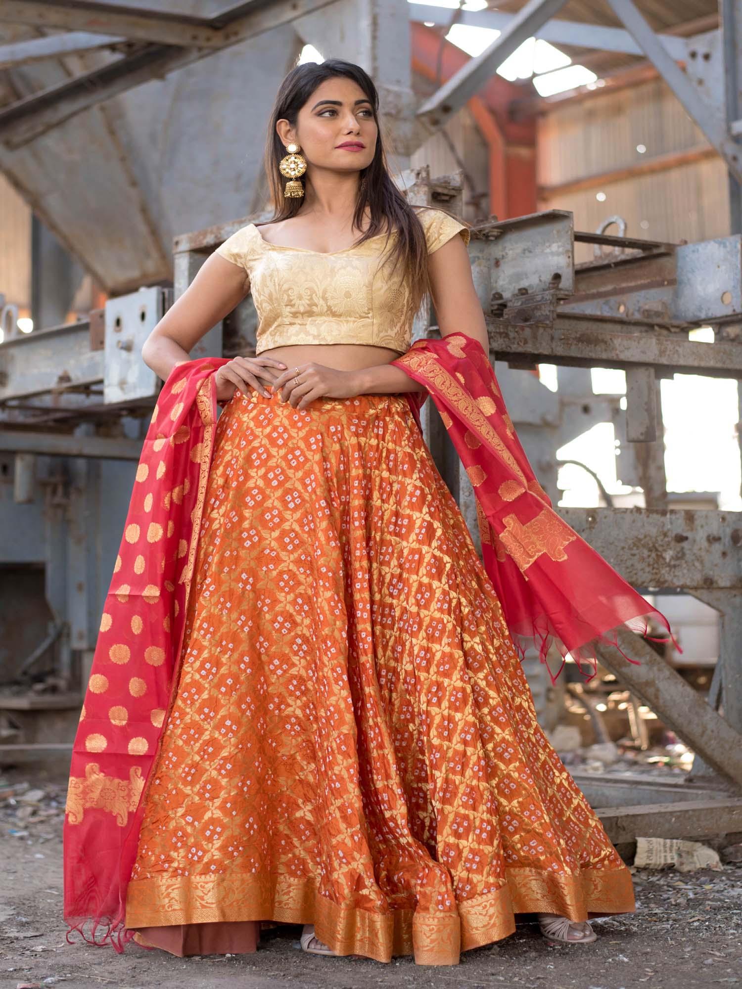 orange off shoulder blouse with banarasi blouse and red dupatta