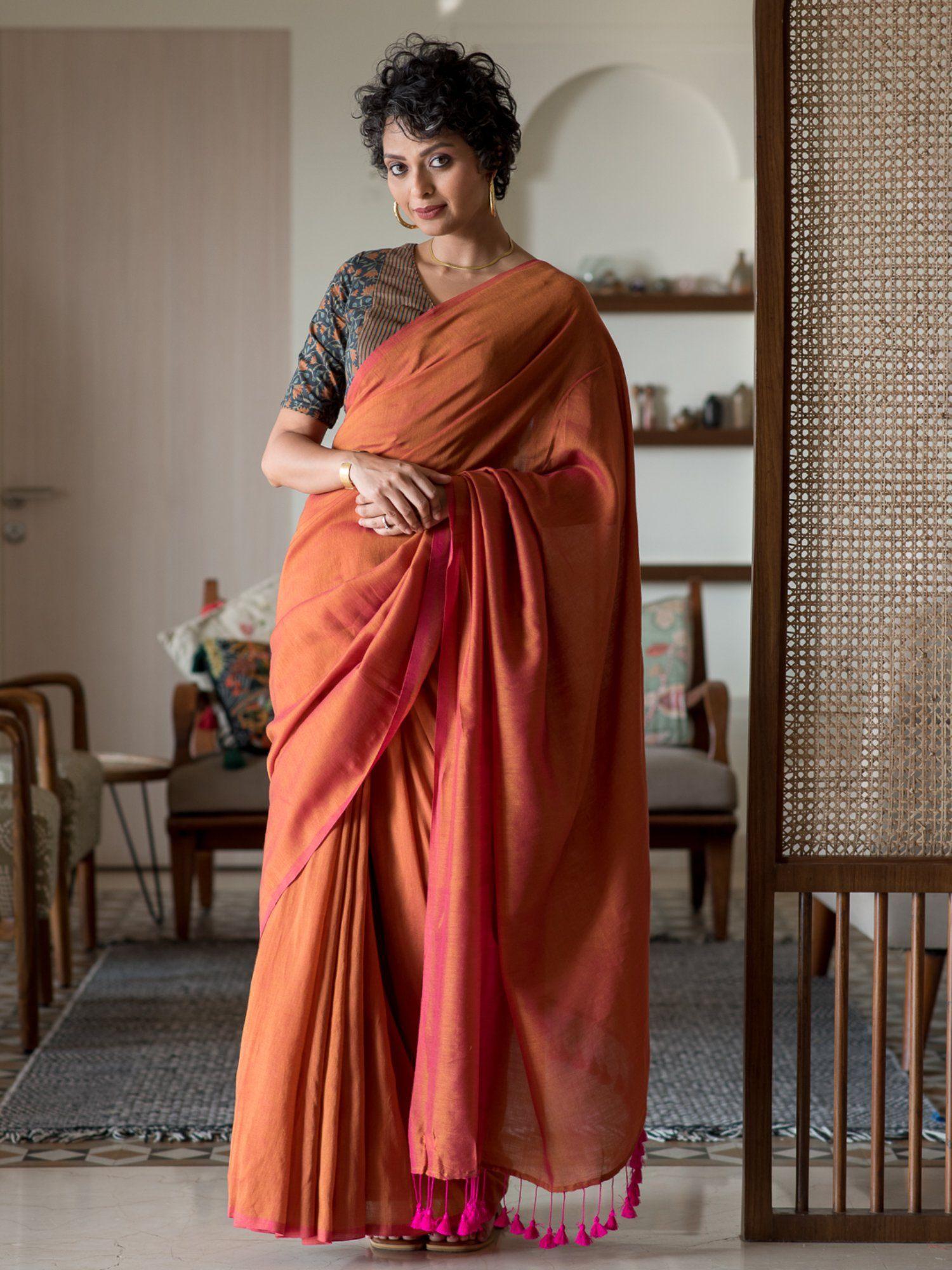 orange solid cotton blend saree without blouse