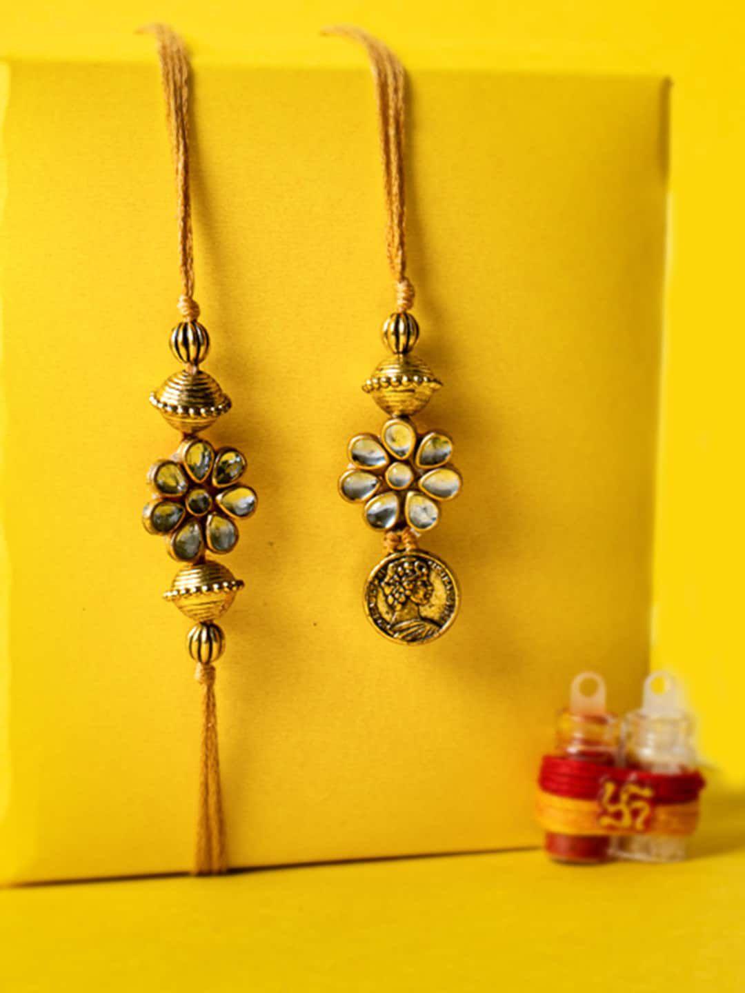 panash set of 2 gold-plated stone-studded rakhis with roli chawal