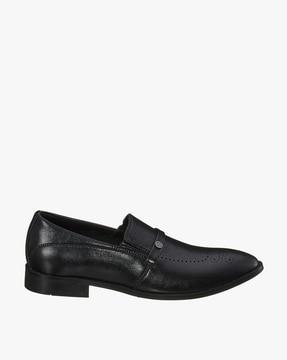 panelled slip-on shoes with broguing