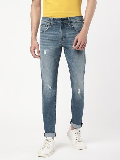 passion blue slim fit lightly washed distressed jeans