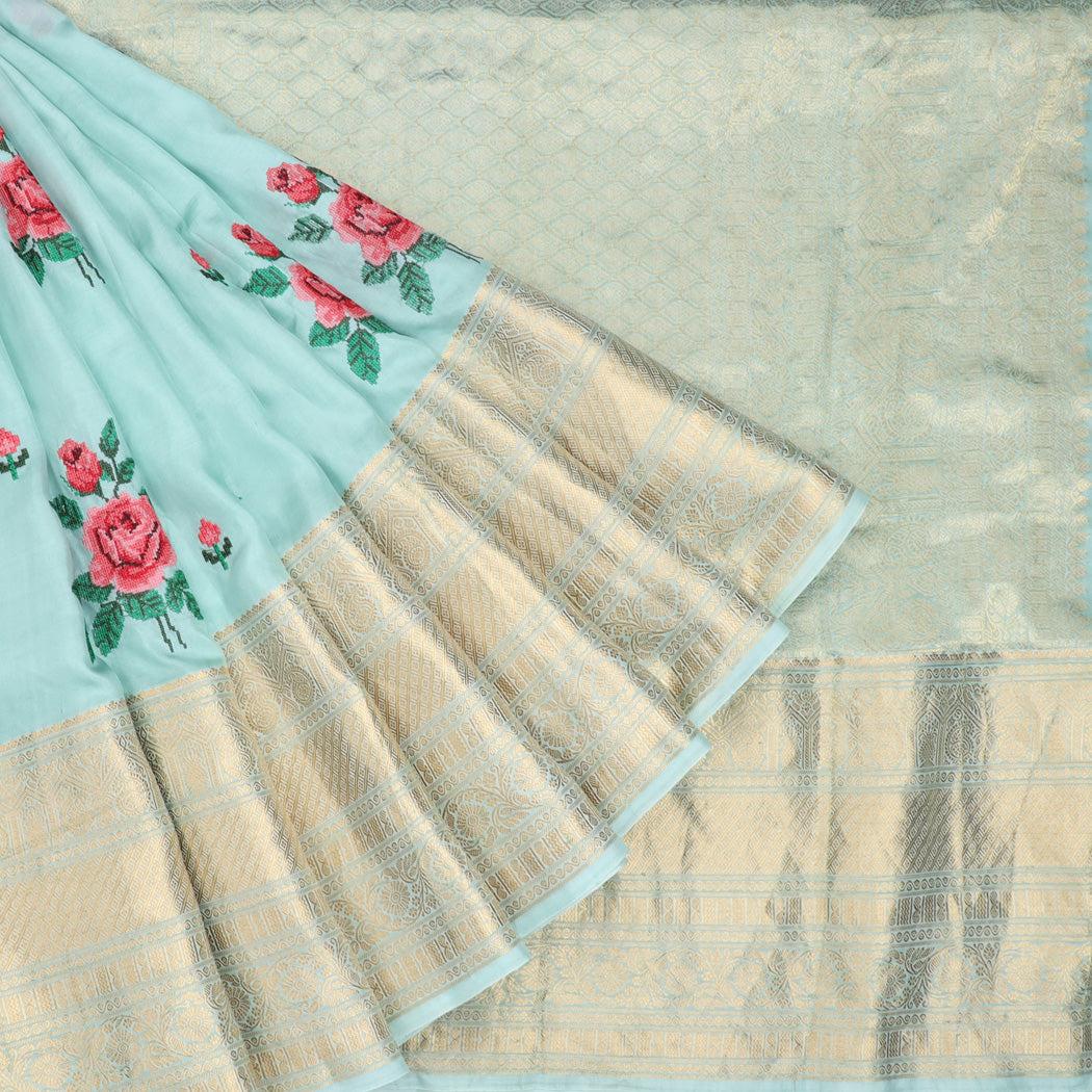 pastel blue silk saree with floral embroidery
