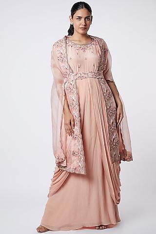 peach draped gown with embroidered cape