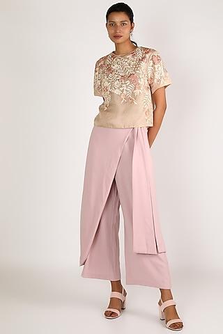peach top with floral detailing