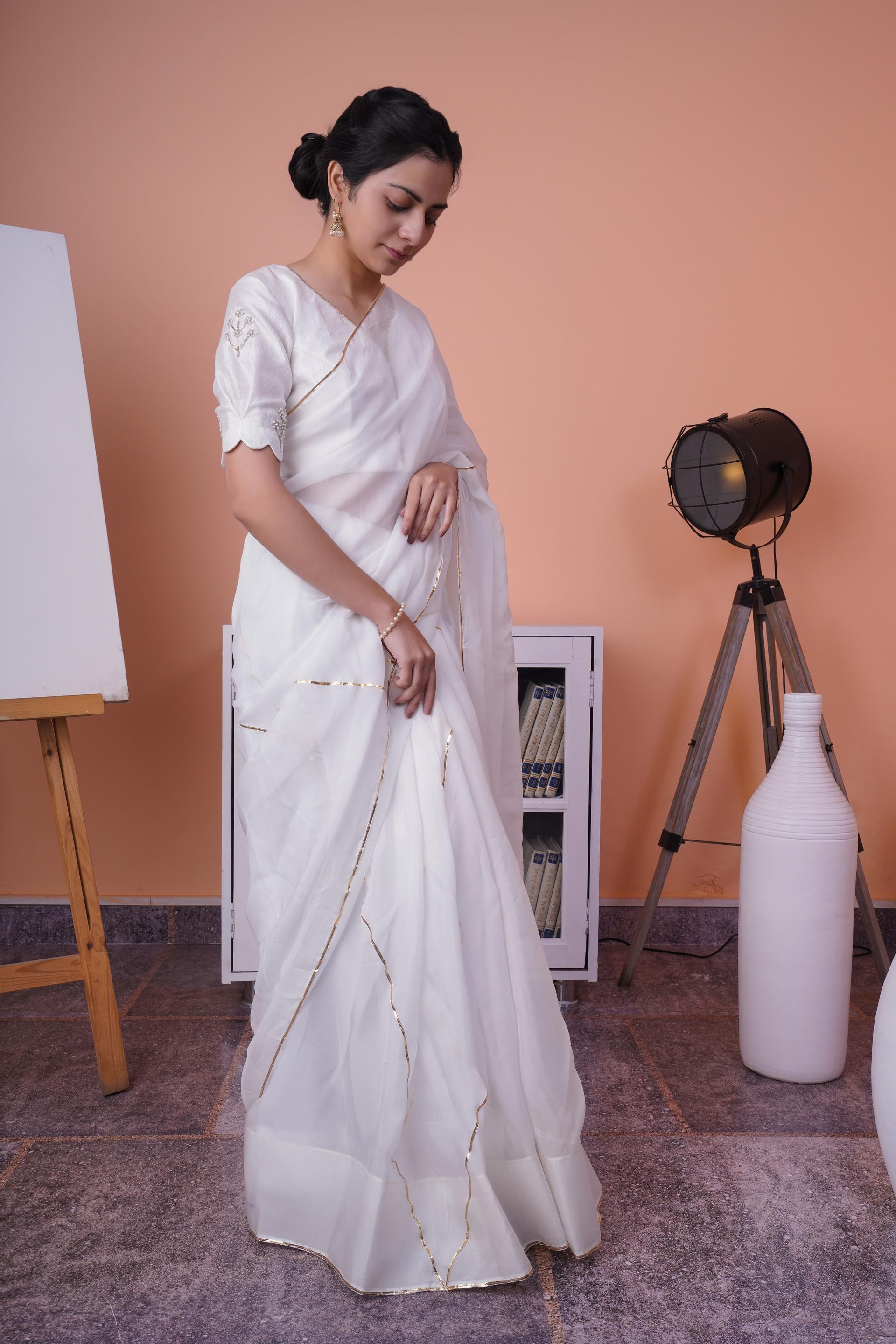 pearl bliss - white silk organza saree paired with hand embroidered raw silk blouse