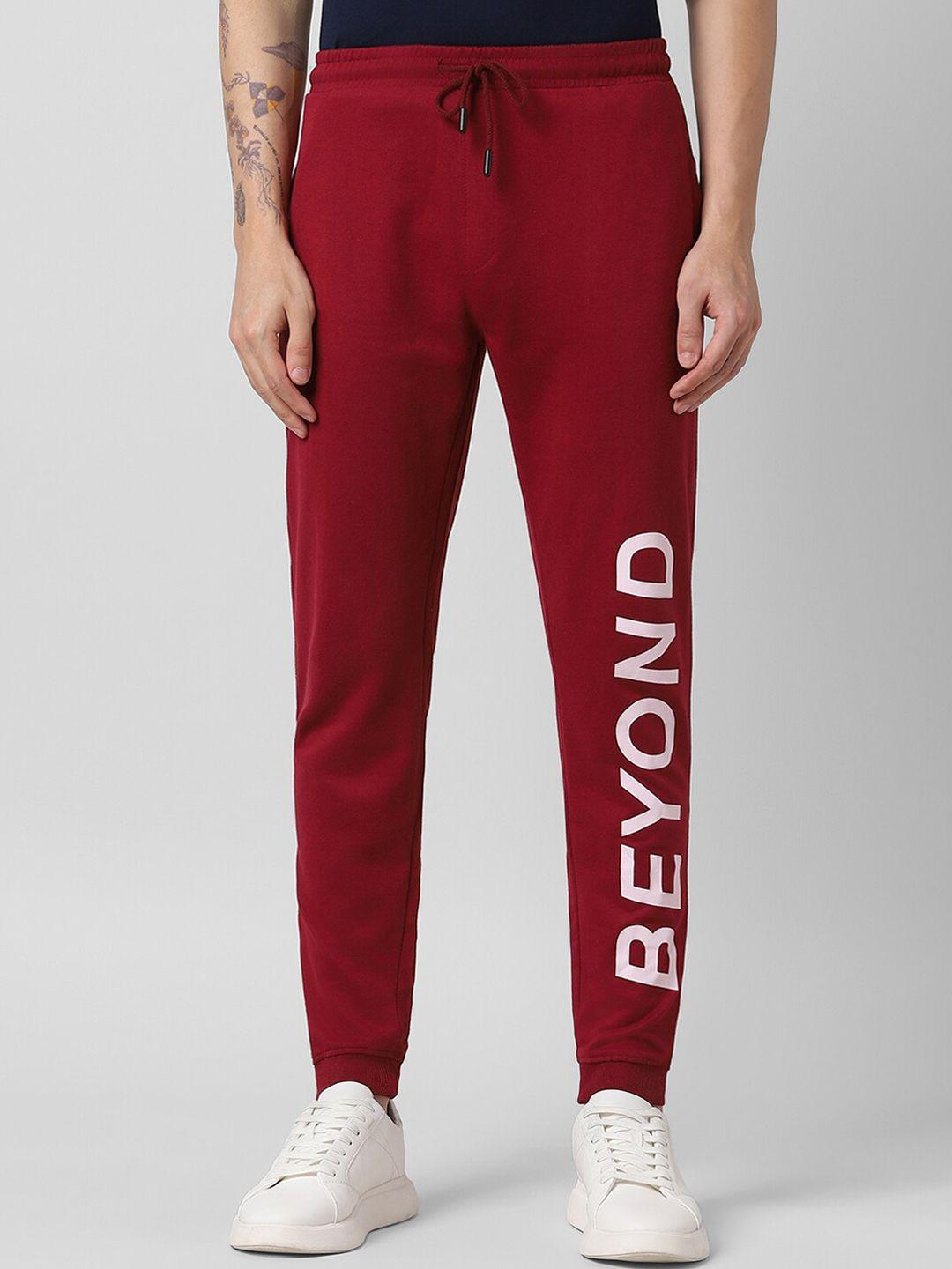 people men red typography printed mid-rise joggers