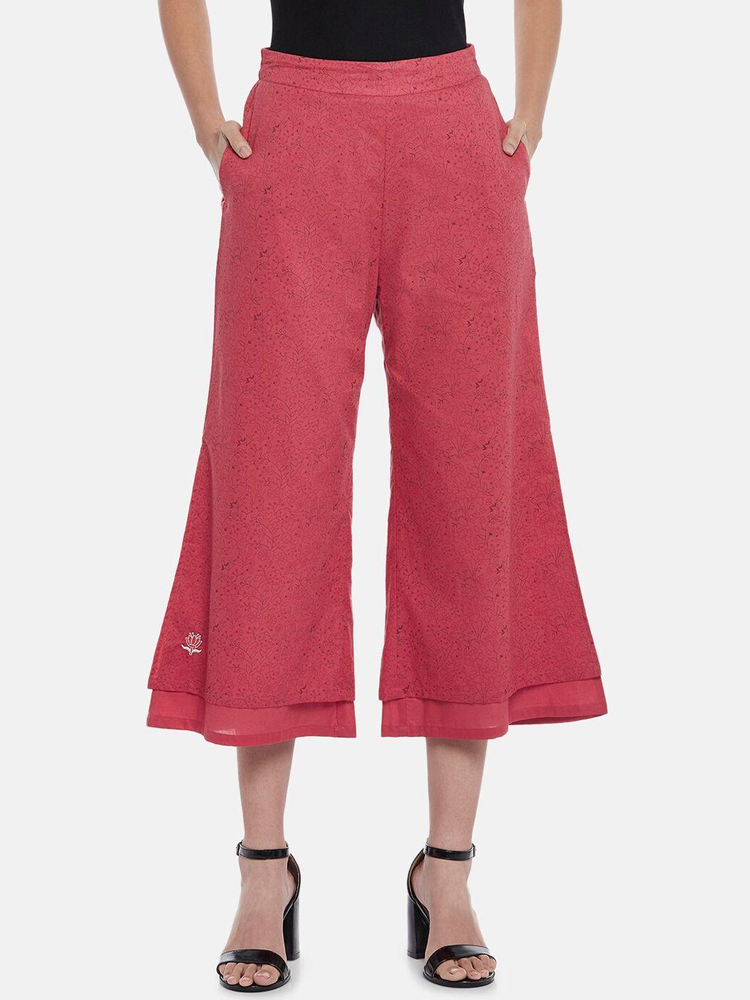 people women red flared trousers
