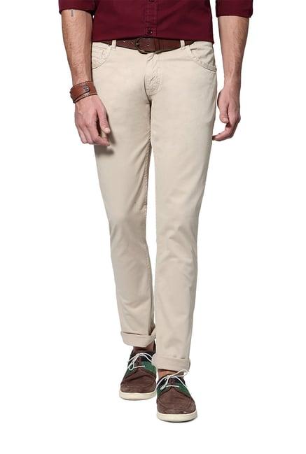 people beige slim fit solid trousers