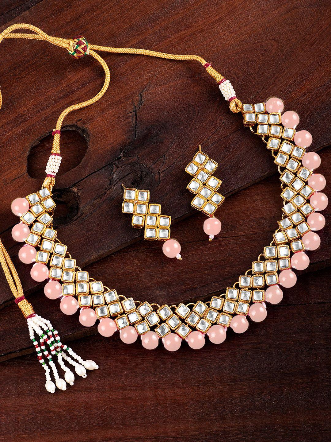 peora peach gold-plated kundan pearl jewellery set