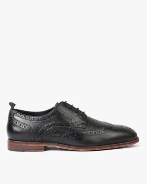 perforated leather wingtip derby shoes