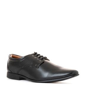 perforated pointed-toe derbys