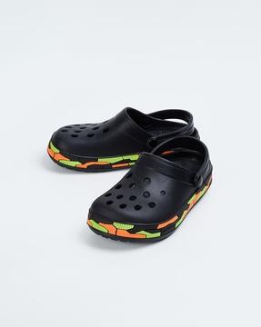 perforated slip-on clogs