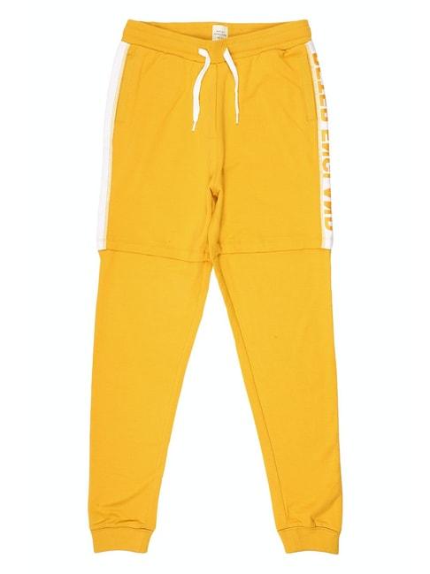 peter england kids yellow solid joggers