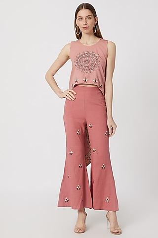 pink asymmetrical top with pants