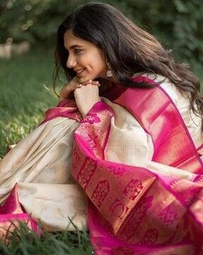 pink banarasi silk saree with zari work in form of traditional motifs saree