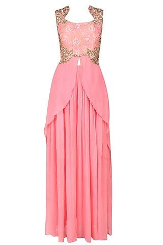 pink embroidered drape top with pink pleated trousers