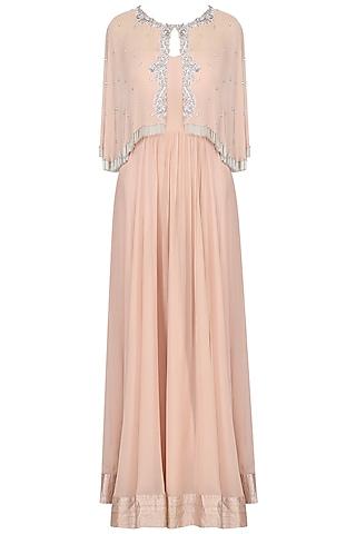 pink off shoulder gown with embroidered cape