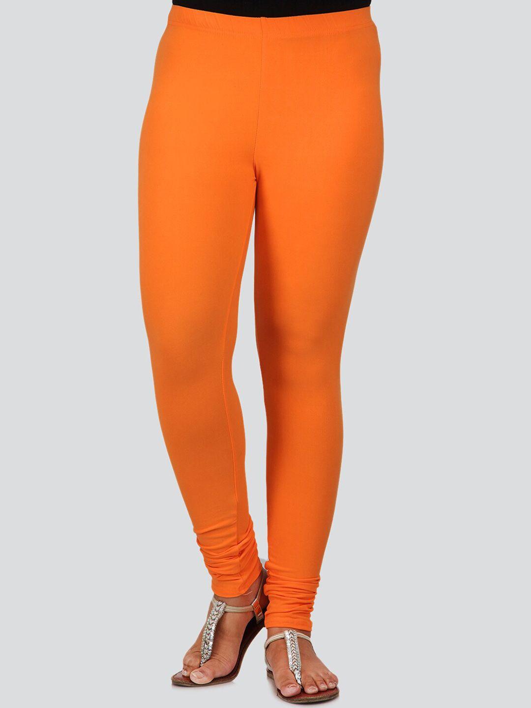 pinkloom women orange solid churidar-length leggings