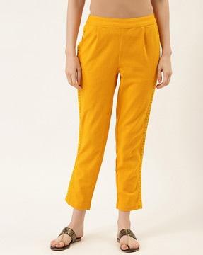 pleat-front relaxed fit trousers with lace detail